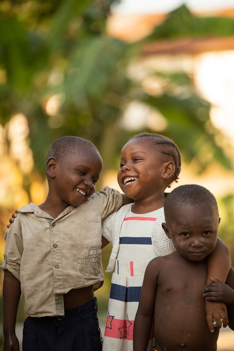 Happy African Children Embracing On Street