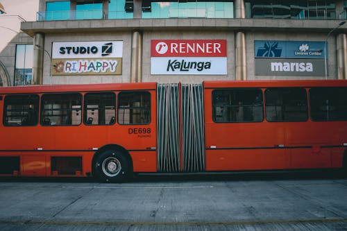Free Red Public Transit Bus on the Street Stock Photo