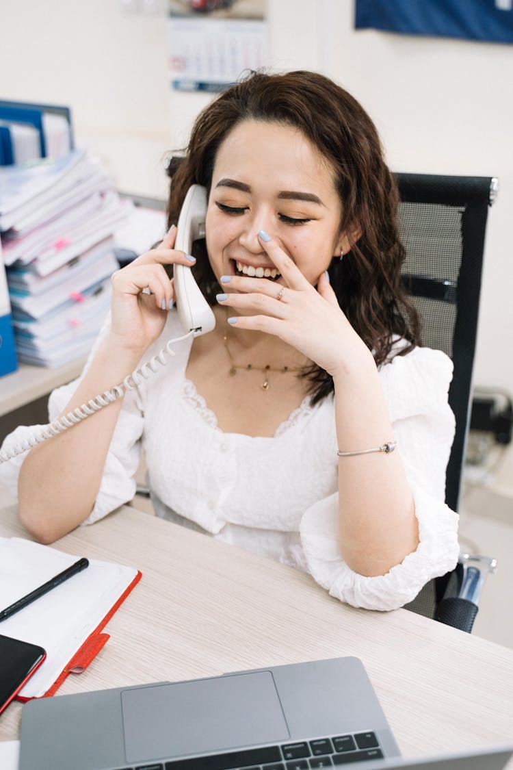 Woman In White Lace Dress Having A Telephone Call