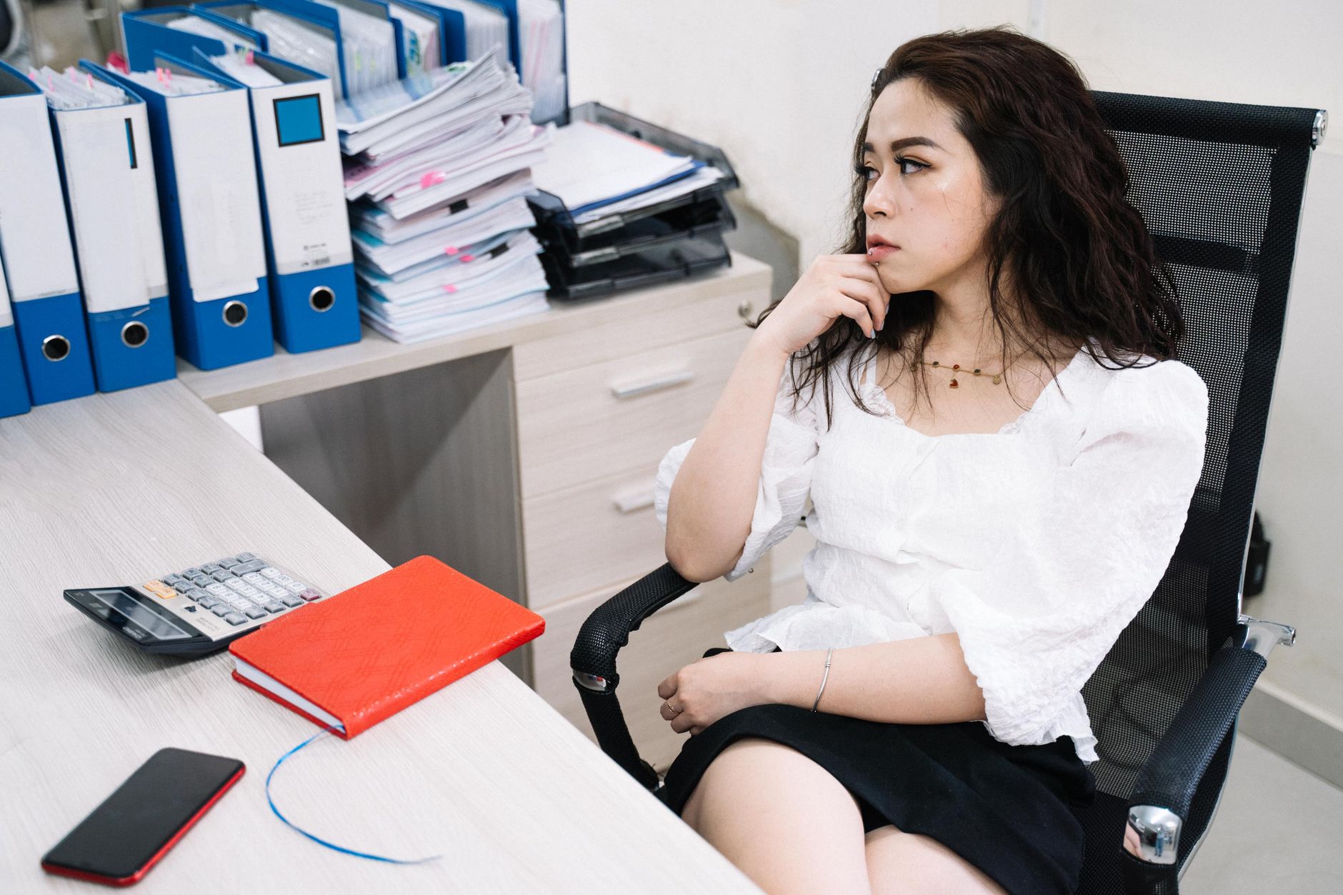 Editorial photo for Can I Sue My Employer for Favoritism, showing employment records and workplace documents.
