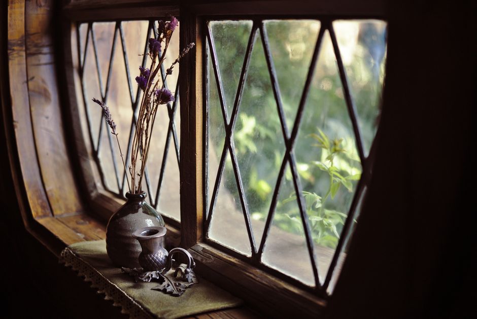 Photo by Omīd Photos on Pexels A charming still life of a rustic window with a vase of dry flowers capturing a vintage essence.