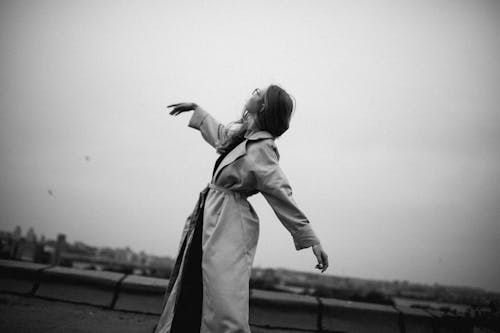 Grayscale Photo of Woman Dancing