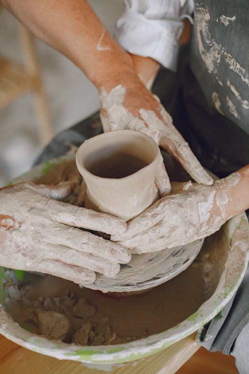 People Doing Pottery with Clay