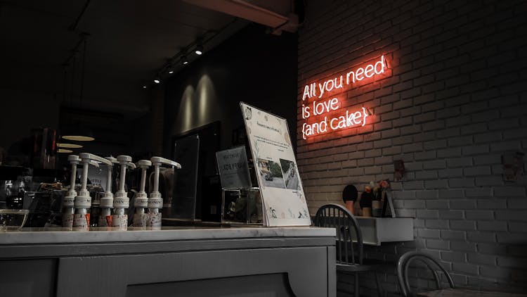 Empty Bar With Illuminated Neon Sign