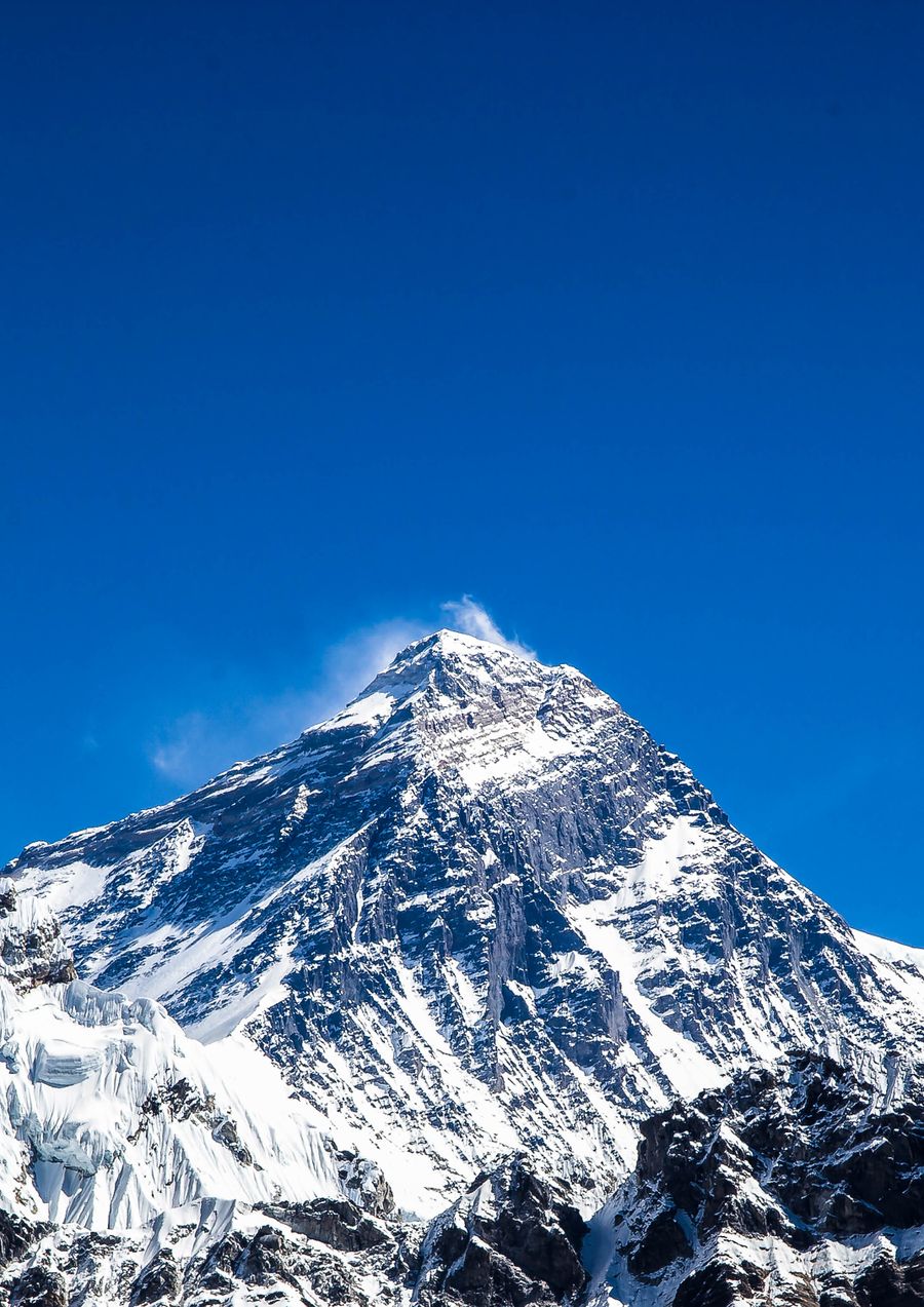 Mount Everest under a blue sky