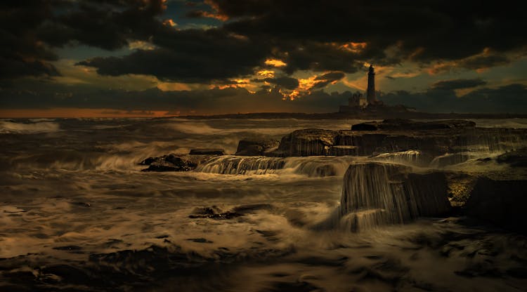 Lighthouse In Restless Sea In Storm