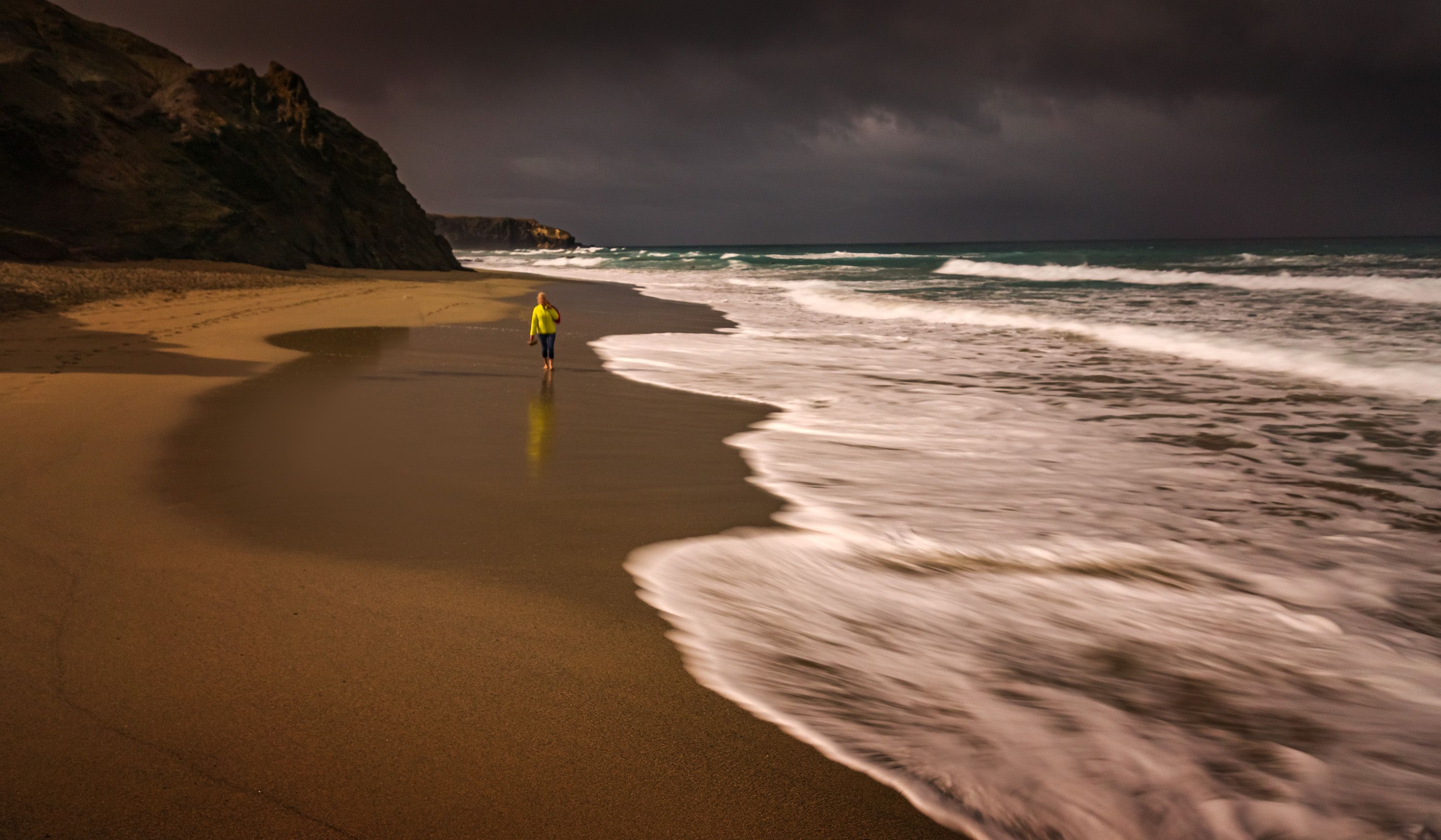 Person in Yellow Shirt Walking on Beach · Free Stock Photo