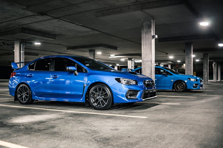 Contemporary Blue Cars On Parking Lot