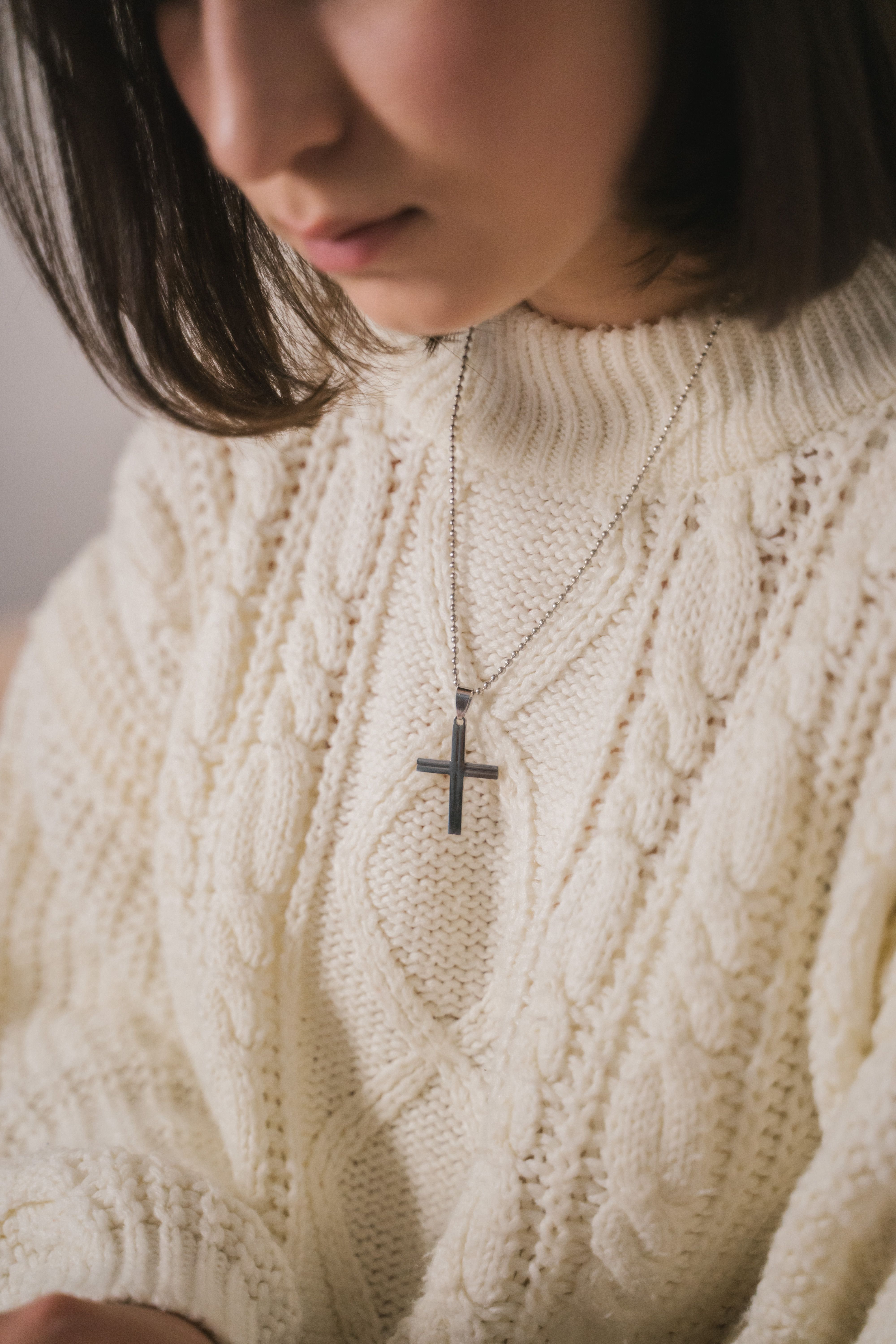 Woman in White Knit Sweater Wearing a Necklace · Free Stock Photo