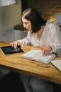 Woman in White Dress Shirt Using Black Tablet Computer