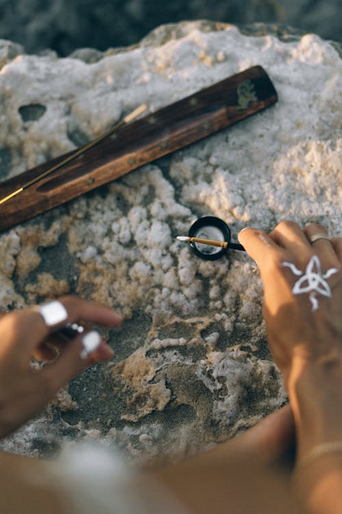 A Person Holding a Paint Brush