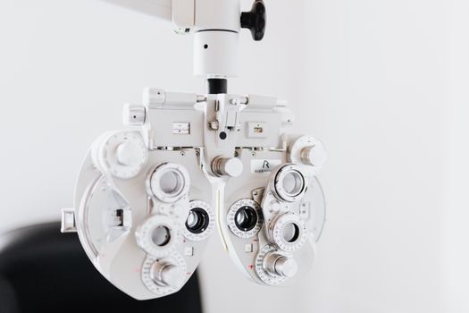 Close-up of a phoropter, an essential tool in eye examinations, used by optometrists.