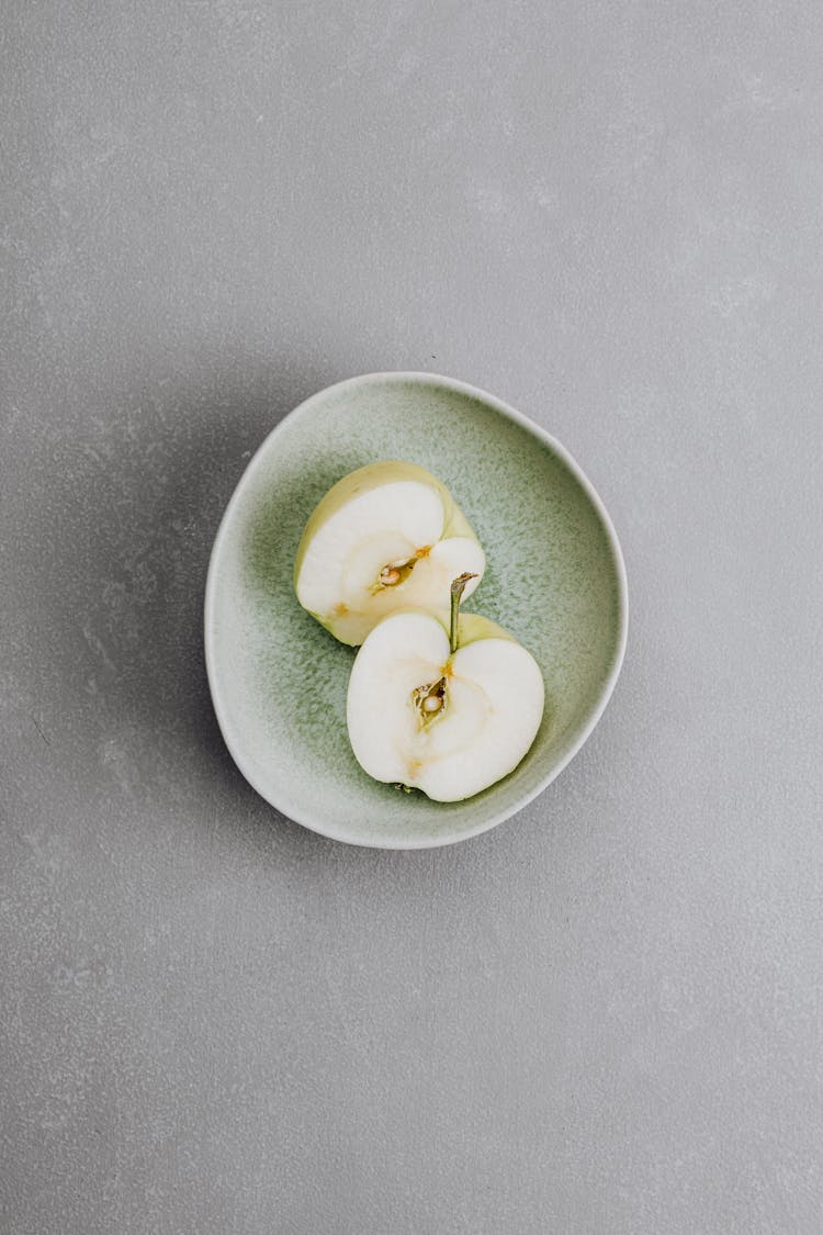 Sliced Green Apple On A Plate