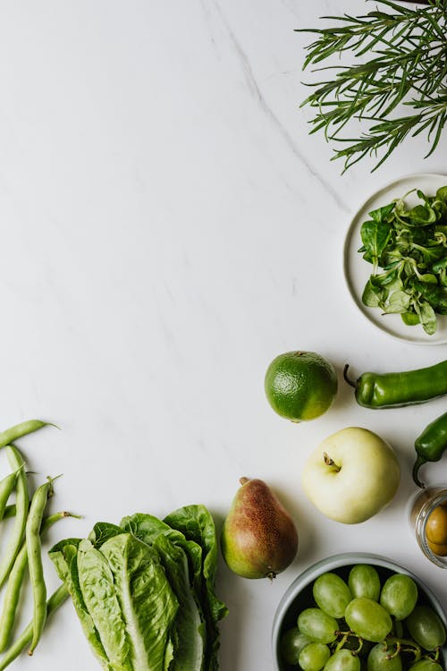 Fresh Fruits and Vegetables on a White Surface