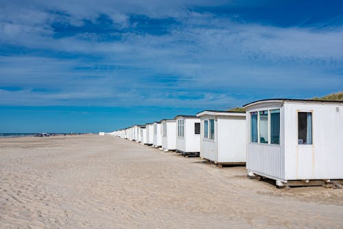 Small Beach Houses on Sand Seashore