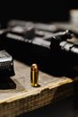 A Bullet on a Wooden Surface