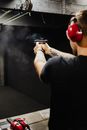 Person in Black Shirt Holding a Gun