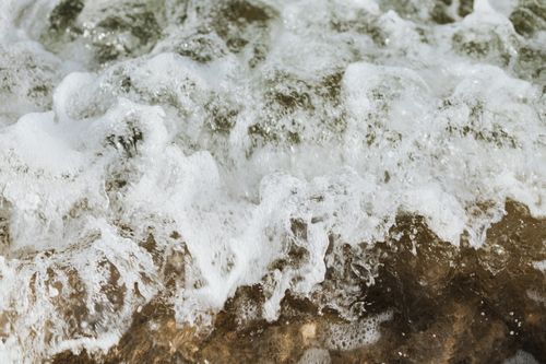 Free Close-up of dynamic ocean waves creating a foamy splash, showcasing nature's power. Stock Photo