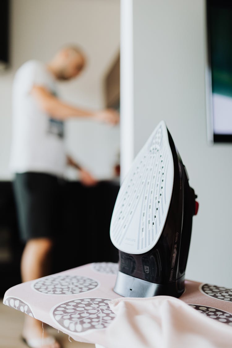 Close Up Photo Of A Black Clothes Iron