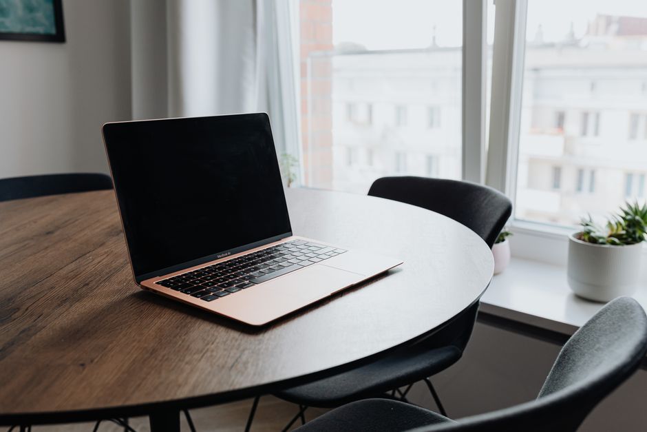 Space-Saving Laptop Table Reviews: 5 Must-Know Features for Tiny Apartment Dwellers Person selecting a space-saving laptop table from a furniture collection