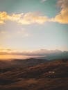 Mountains Under White Clouds