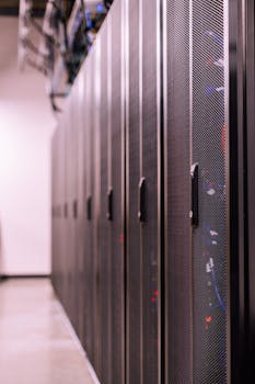 Detailed view of network server racks in a modern data center, highlighting technology infrastructure.