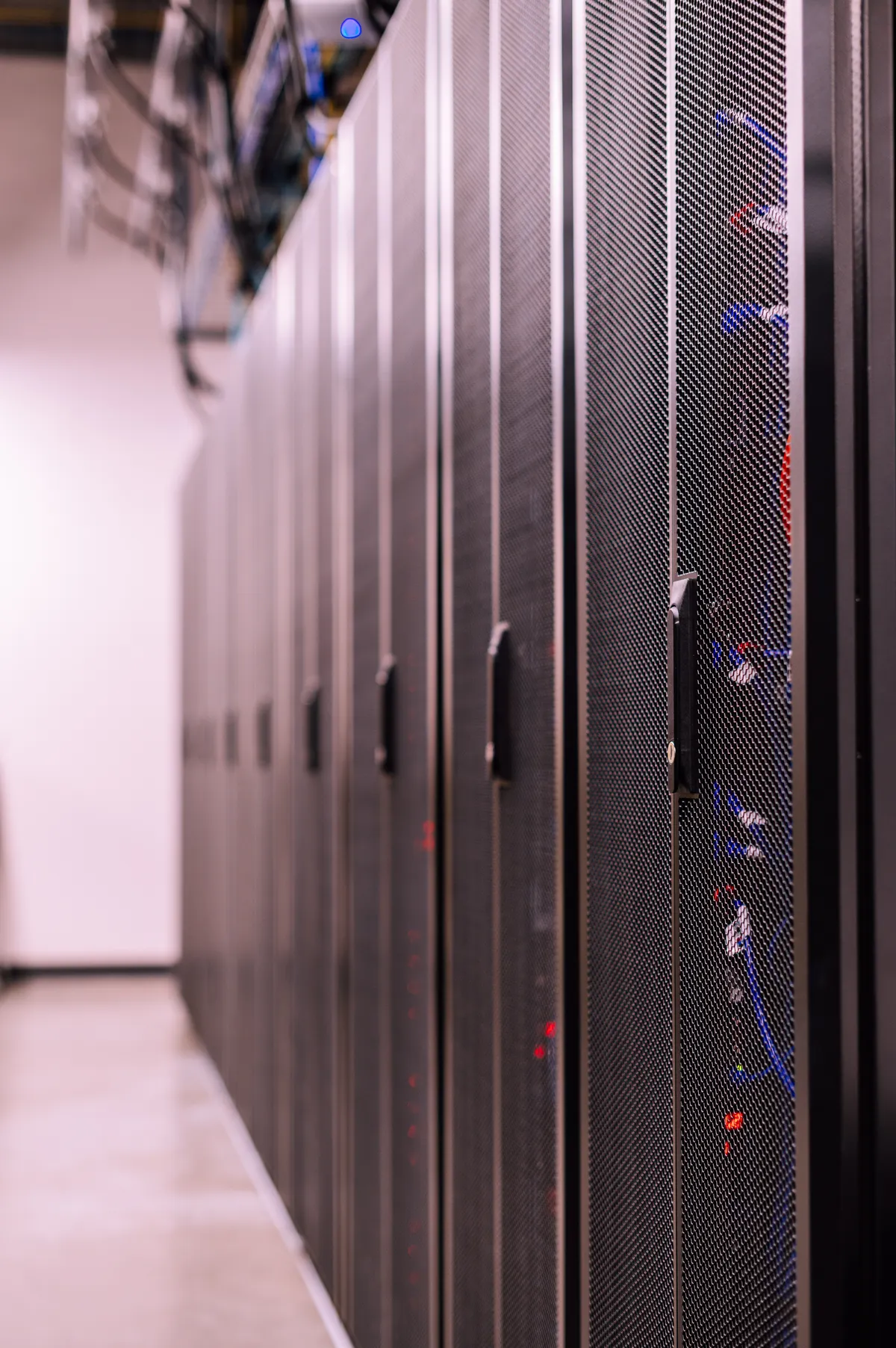 A row of server racks representing the shared clearing infrastructure behind both platforms
