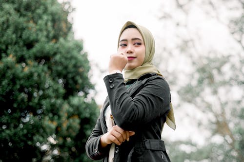 Free Woman in Black Leather Jacket Wearing Beige Hijab  Stock Photo