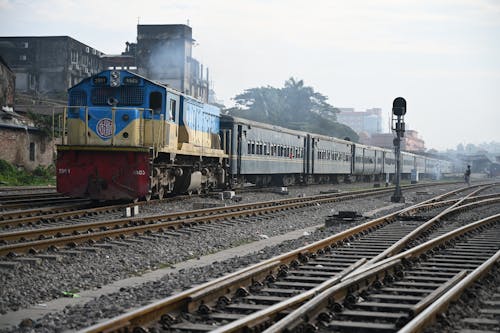 Blue and Red Train on Rail Tracks