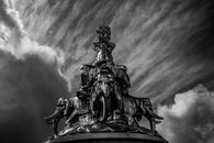 Grayscale Photo of Man Riding Horse Statue
