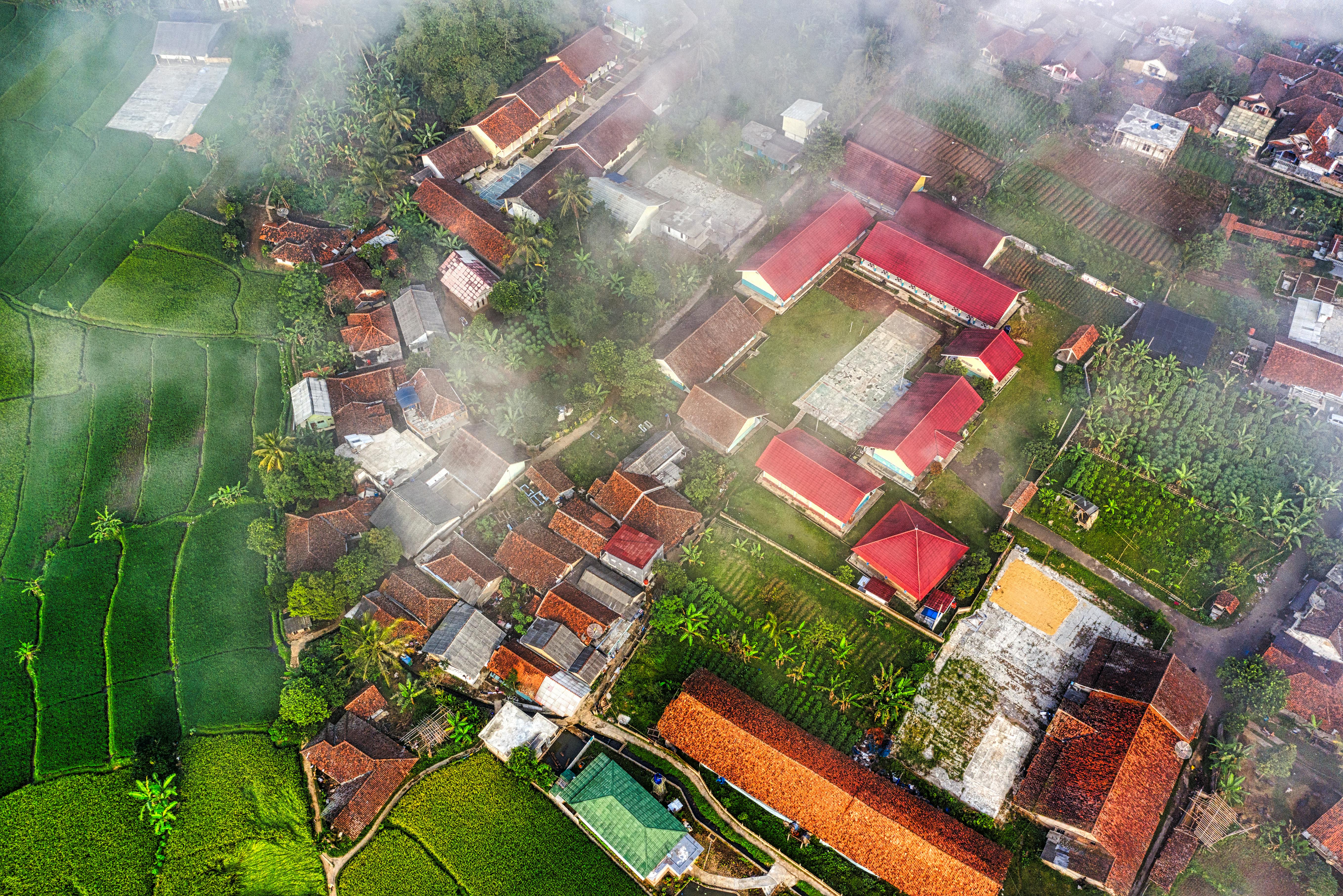 Aerial View Of Houses And Agricultural Land · Free Stock Photo