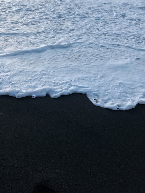 Sea Foam Washed on the Ashore the Beach 