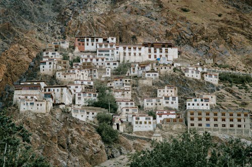 Free Ancient Tibetan monastery located on mountain slope in wild valley Stock Photo