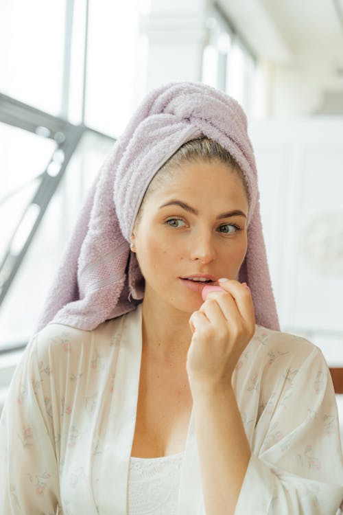 Free Woman in White Robe With Pink Towel on Her Head Stock Photo