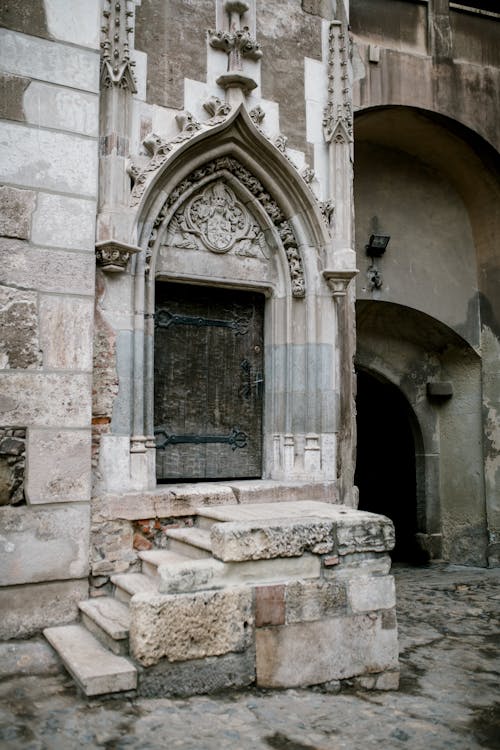 Arched door and passage of ancient medieval stone castle