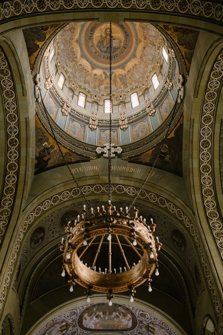 Interior Of Historical Romanian Orthodox Cathedral With Arched Walls And Dome Decorated With Icon