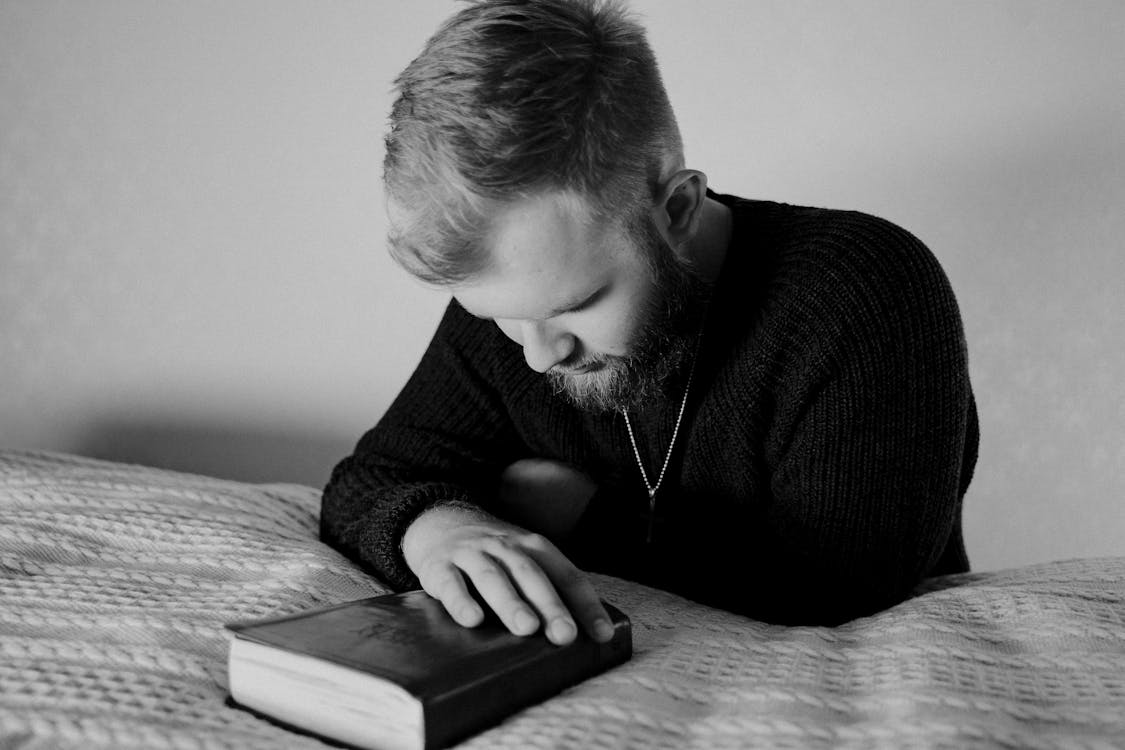 Free Grayscale Photo of a Bearded Man Praying Stock Photo