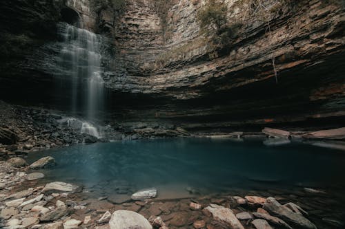 Free Water Falls on Rocky Shore Stock Photo