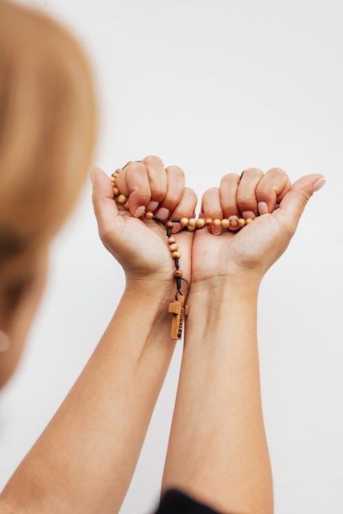 Close-Up Shot of a Person Holding a Rosary