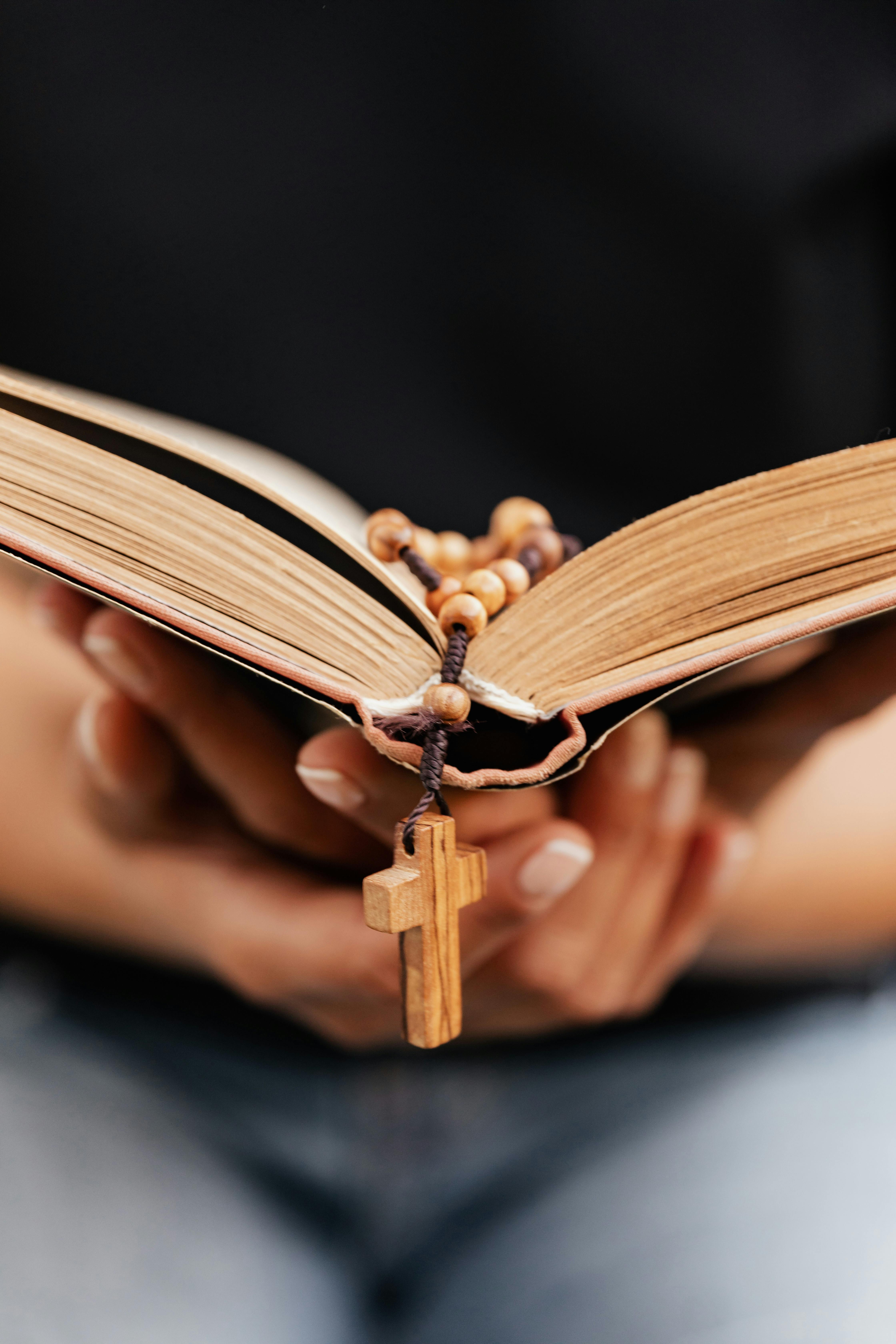 Download A Wooden Rosary Is Sitting On Top Of A Book Wallpaper  Wallpapers com