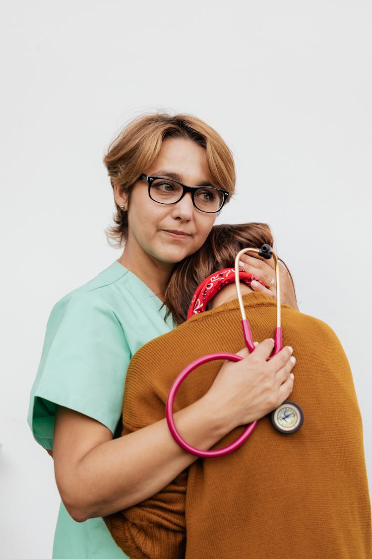 
A Doctor Consoling A Person