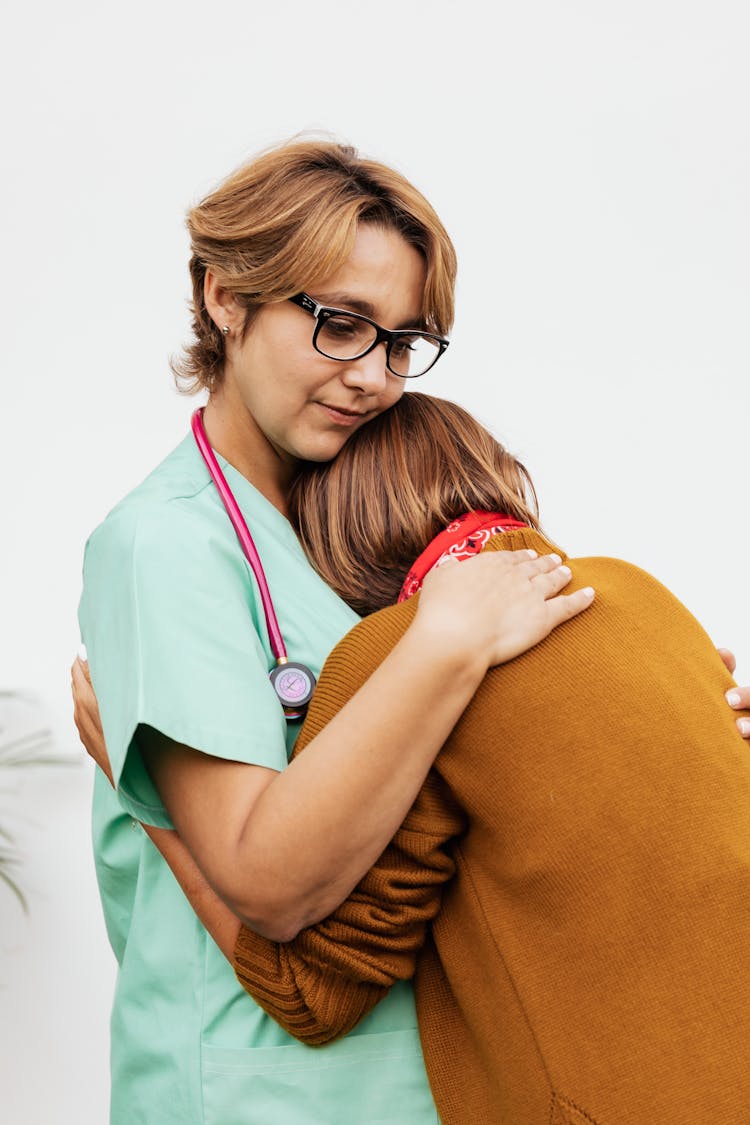 
A Doctor Consoling A Person