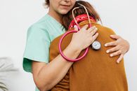 A Doctor Consoling a Person