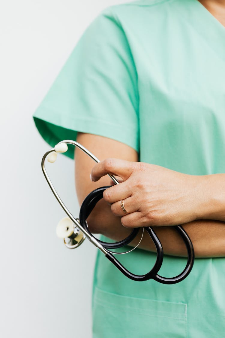 Person Holding Stethoscope