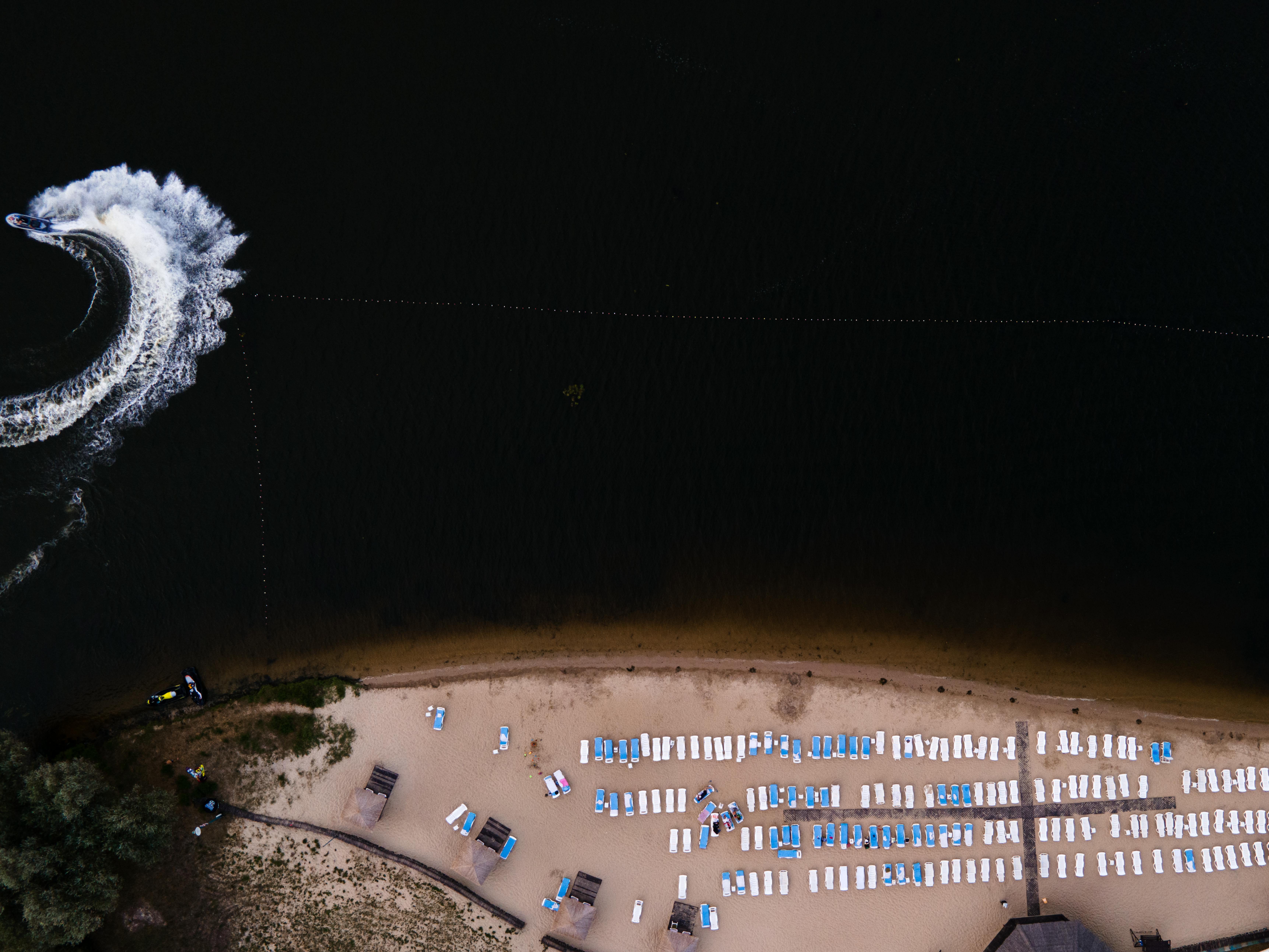 Prescription Goggle Inserts - Drone shot of a beach with a jet ski creating a wave pattern in Cherkasy, Ukraine.