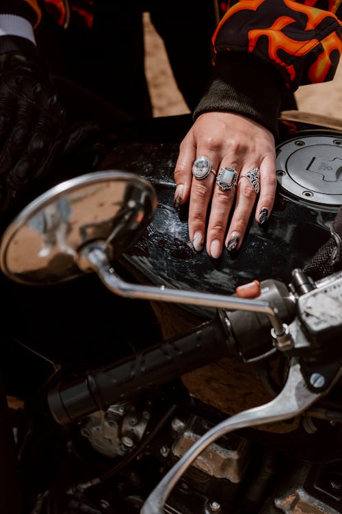 Free Hand with Rings on a Motorcycle Stock Photo