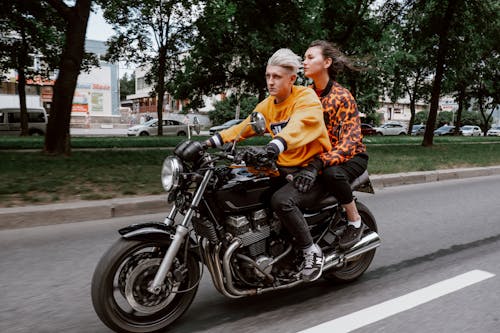 A Couple Riding Motorcycle