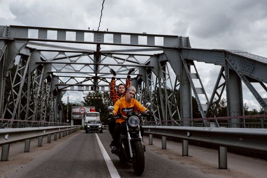 A Happy Couple Riding a Motorcycle Together