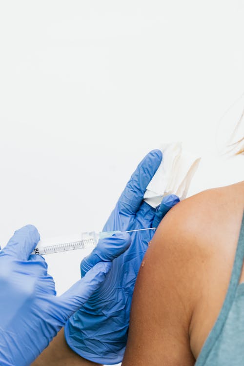 A Person Injecting Vaccine