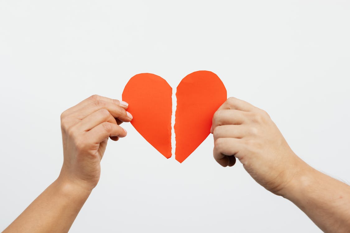 Free Holding a Broken Heart Stock Photo